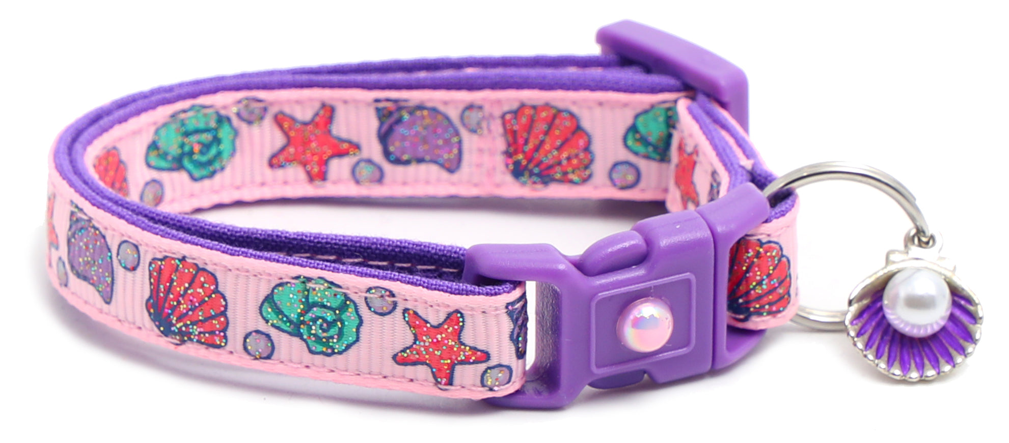 Beachcomber Breakaway Cat Collar in vibrant colors, featuring a breakaway clip and removable bell, made from soft reinforced cotton.